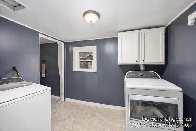 122 Dwight Ave SE, Grand Rapids, MI 49506 - laundry area featuring washing machine and clothes dryer and cabinet space