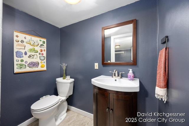 122 Dwight Ave SE, Grand Rapids, MI 49506 - bathroom featuring baseboards and vanity