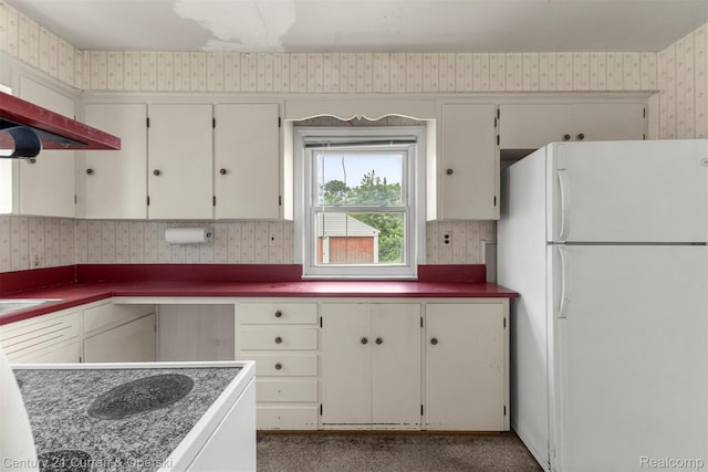 711 N Highland St, Dearborn, MI 48128 - kitchen featuring freestanding refrigerator, wallpapered walls, and ventilation hood