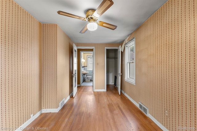 711 N Highland St, Dearborn, MI 48128 - corridor featuring wallpapered walls and light wood-style floors