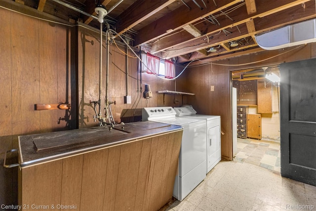 711 N Highland St, Dearborn, MI 48128 - washroom with washer and clothes dryer, light flooring, and wood walls