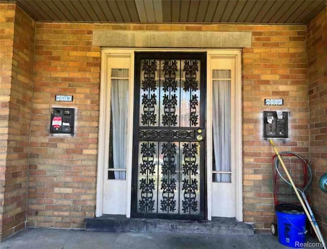 2683 Sturtevant St, Detroit, MI 48206 - view of exterior entry featuring brick siding
