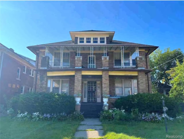 2683 Sturtevant St, Detroit, MI 48206 - view of front of house with a balcony and covered porch