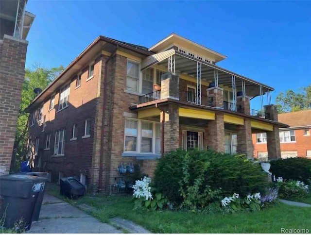 2683 Sturtevant St, Detroit, MI 48206 - view of side of home with a balcony and brick siding