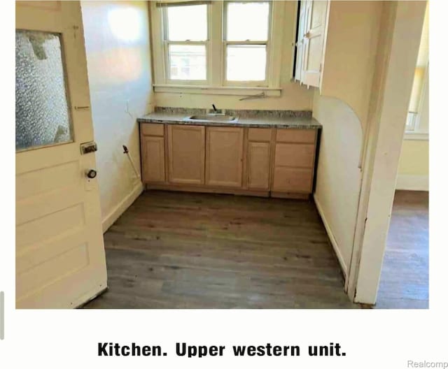 2683 Sturtevant St, Detroit, MI 48206 - kitchen with wood finished floors and light brown cabinetry