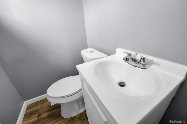 3217 Donna Ave, Warren, MI 48091 - half bath featuring wood finished floors and vanity