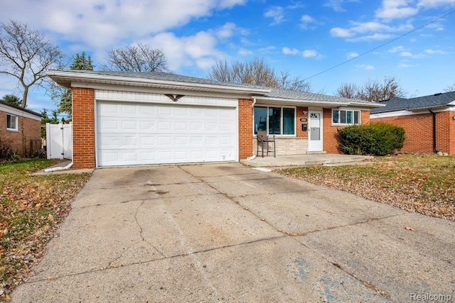 3217 Donna Ave, Warren, MI 48091 - ranch-style house with brick siding, driveway, and a garage