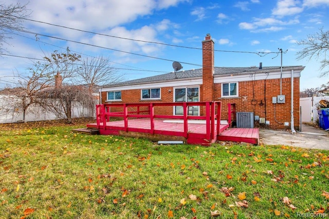 3217 Donna Ave, Warren, MI 48091 - rear view of property with a wooden deck, brick siding, and a chimney