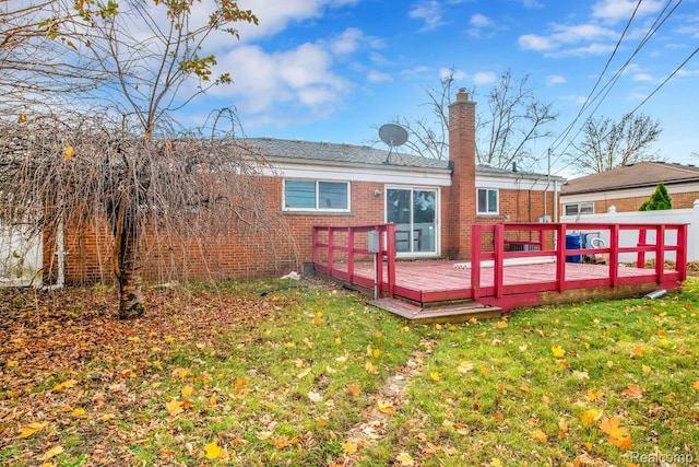 3217 Donna Ave, Warren, MI 48091 - back of house featuring brick siding, a deck, and a chimney