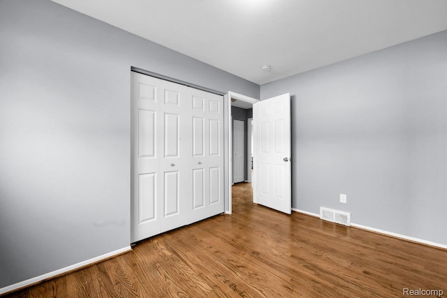 3217 Donna Ave, Warren, MI 48091 - unfurnished bedroom featuring wood finished floors and a closet