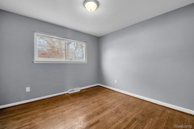 3217 Donna Ave, Warren, MI 48091 - spare room featuring baseboards and wood finished floors