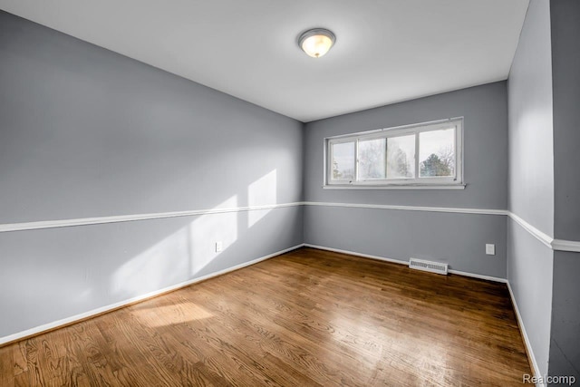 3217 Donna Ave, Warren, MI 48091 - spare room featuring wood finished floors