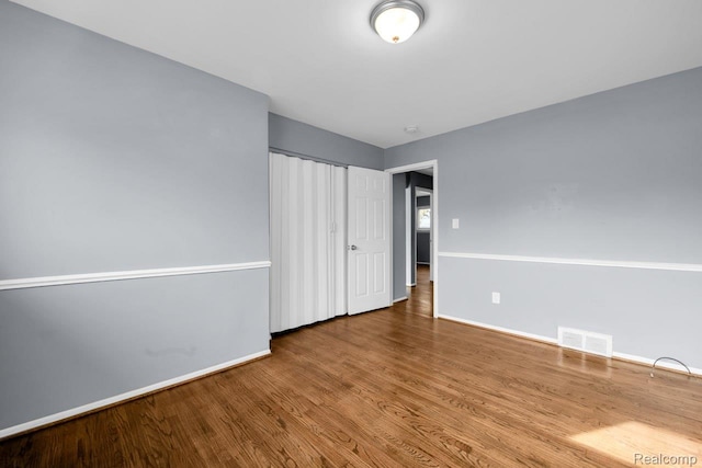 3217 Donna Ave, Warren, MI 48091 - unfurnished bedroom featuring wood finished floors and baseboards