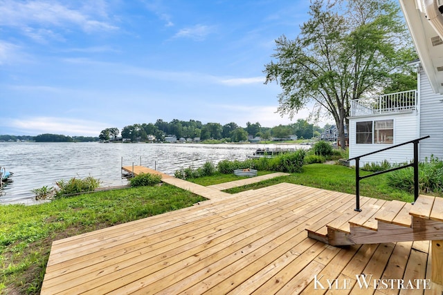 12230 Mac Dr NE, Belding, MI 48809 - wooden terrace featuring a water view and a boat dock