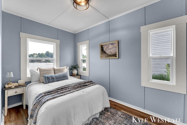 12230 Mac Dr NE, Belding, MI 48809 - bedroom featuring dark wood finished floors and crown molding