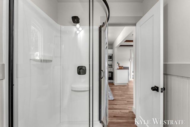 12230 Mac Dr NE, Belding, MI 48809 - bathroom with a shower stall and wood finished floors