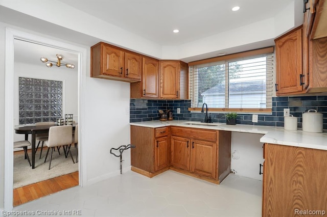17617 Kentucky St, Detroit, MI 48221 - kitchen with brown cabinets, light countertops, decorative backsplash, and recessed lighting