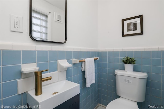17617 Kentucky St, Detroit, MI 48221 - bathroom with vanity, tile walls, and a wainscoted wall