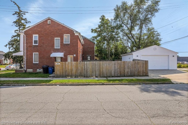 17617 Kentucky St, Detroit, MI 48221 - view of property exterior featuring a garage, an outbuilding, and brick siding