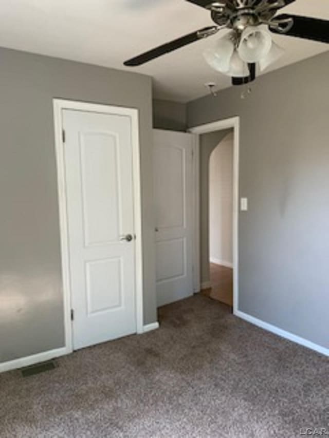 609 Orchard Ln, Tecumseh, MI 49286 - unfurnished bedroom with carpet flooring and a ceiling fan