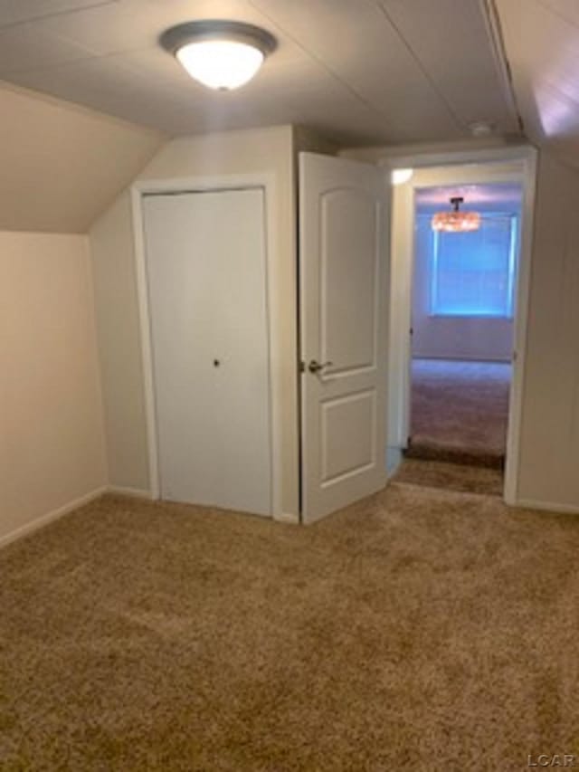 609 Orchard Ln, Tecumseh, MI 49286 - additional living space with carpet and vaulted ceiling