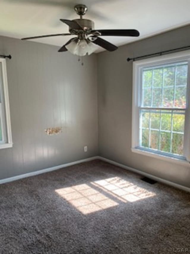 609 Orchard Ln, Tecumseh, MI 49286 - carpeted empty room with baseboards and ceiling fan