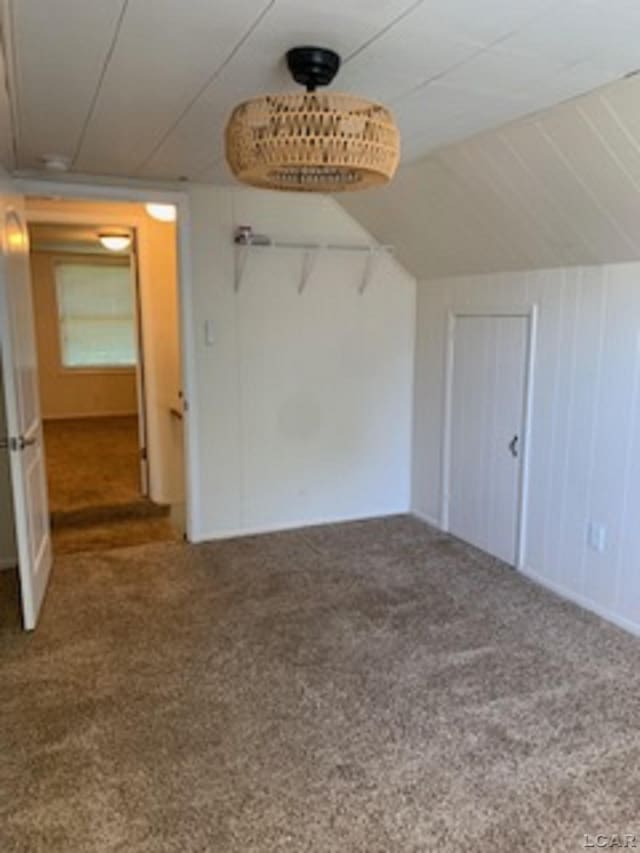 609 Orchard Ln, Tecumseh, MI 49286 - bonus room featuring carpet and lofted ceiling