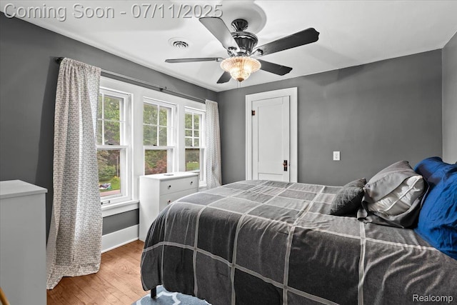 342 King St, Highland, MI 48357 - bedroom with wood finished floors and a ceiling fan