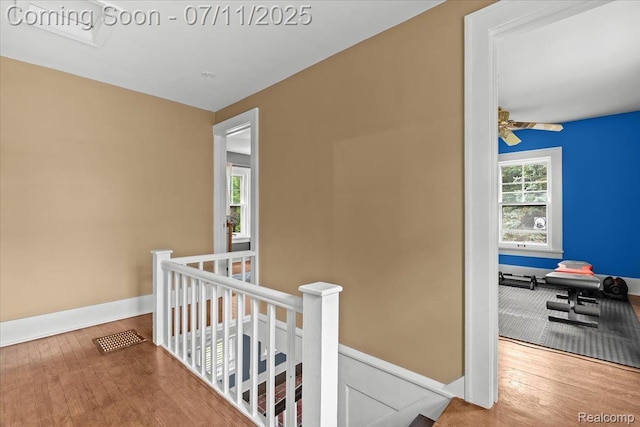 342 King St, Highland, MI 48357 - corridor featuring an upstairs landing and wood finished floors