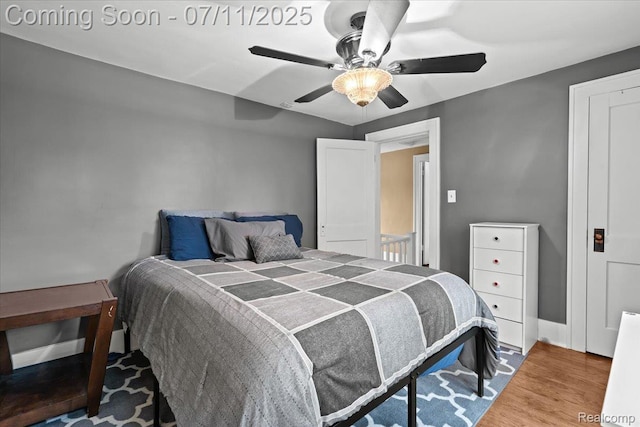 342 King St, Highland, MI 48357 - bedroom with wood finished floors and a ceiling fan