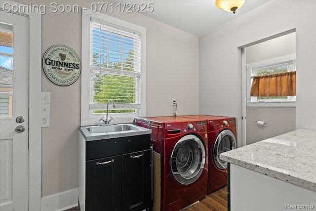 342 King St, Highland, MI 48357 - laundry area featuring separate washer and dryer, dark wood-style floors, and cabinet space