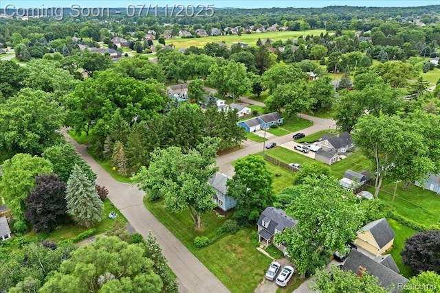 342 King St, Highland, MI 48357 - view of property location with a tree filled landscape