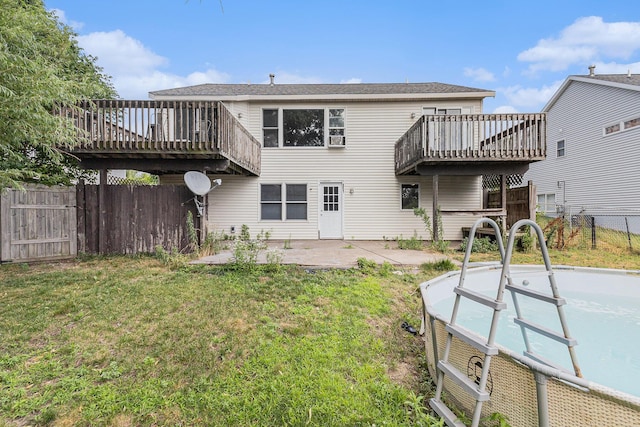 2953 Sunrise Ave, Holland, MI 49424 - back of property featuring a fenced backyard, a wooden deck, and a patio area