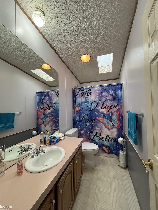 2500 Mann Rd, Clarkston, MI 48356 - full bathroom featuring a skylight, vanity, tile patterned floors, a textured ceiling, and a shower with curtain
