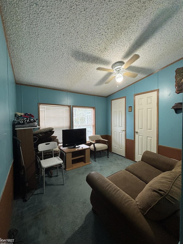 2500 Mann Rd, Clarkston, MI 48356 - living area featuring carpet floors, a ceiling fan, vaulted ceiling, and a textured ceiling