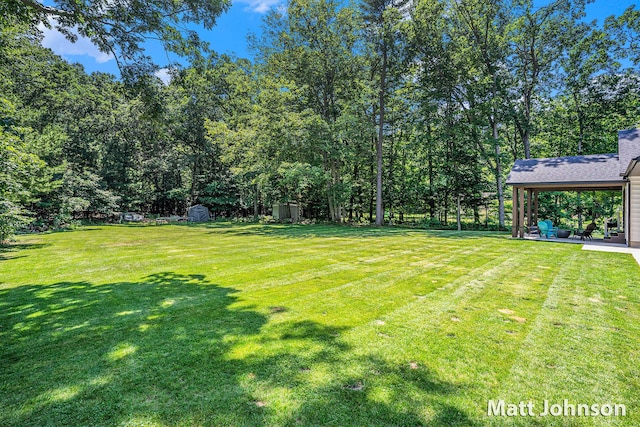 2771 Deer Run Rd, Muskegon, MI 49445 - view of grassy yard with a patio
