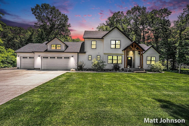 2771 Deer Run Rd, Muskegon, MI 49445 - modern farmhouse featuring an attached garage, concrete driveway, a yard, and roof with shingles