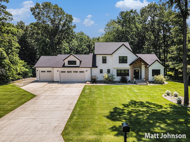 2771 Deer Run Rd, Muskegon, MI 49445 - modern inspired farmhouse featuring driveway, a garage, a front lawn, board and batten siding, and roof with shingles