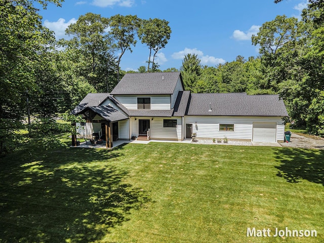 2771 Deer Run Rd, Muskegon, MI 49445 - view of front of house with an attached garage, a front lawn, roof with shingles, and a patio