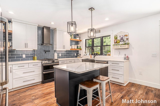 2771 Deer Run Rd, Muskegon, MI 49445 - kitchen with stainless steel appliances, wall chimney range hood, light wood-style flooring, a breakfast bar, and backsplash