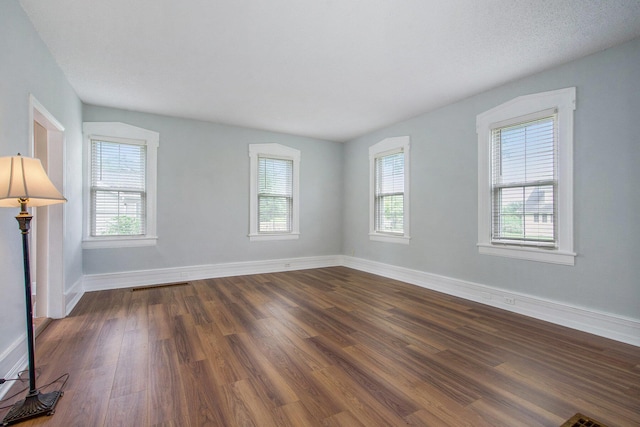9148 Austin Rd, Saline, MI 48176 - unfurnished room with dark wood-style flooring and baseboards