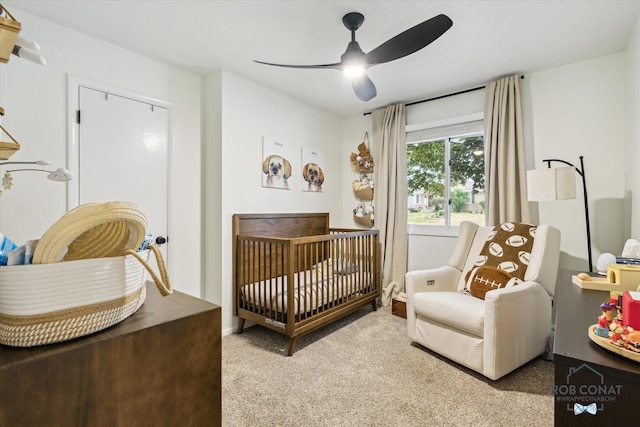 2641 Garfield Ave NW, Grand Rapids, MI 49544 - carpeted bedroom with a crib and ceiling fan