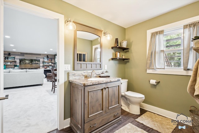 2641 Garfield Ave NW, Grand Rapids, MI 49544 - bathroom featuring vanity and wood finished floors