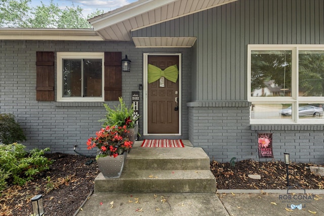 2641 Garfield Ave NW, Grand Rapids, MI 49544 - doorway to property featuring brick siding