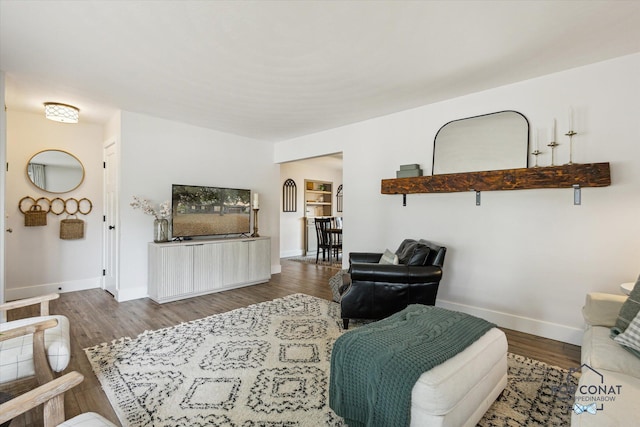 2641 Garfield Ave NW, Grand Rapids, MI 49544 - living room featuring baseboards and wood finished floors