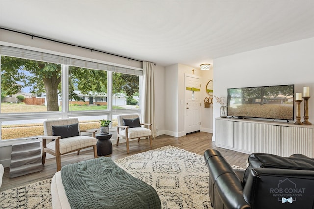 2641 Garfield Ave NW, Grand Rapids, MI 49544 - living room featuring wood finished floors and baseboards
