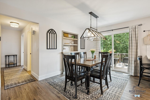 2641 Garfield Ave NW, Grand Rapids, MI 49544 - dining area with wood finished floors and built in shelves