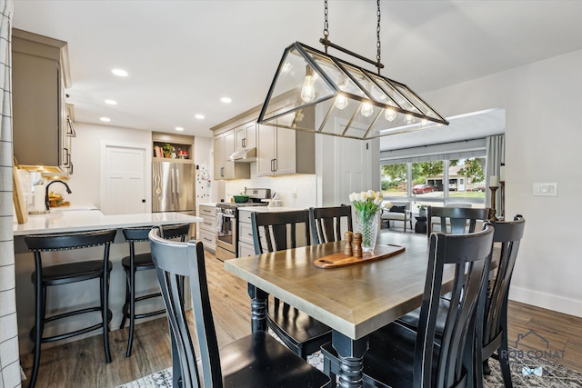 2641 Garfield Ave NW, Grand Rapids, MI 49544 - dining room with light wood-style flooring and recessed lighting