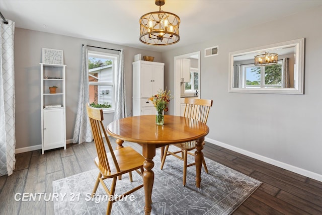 6357 Mackinaw Rd, Saginaw, MI 48604 - dining space with a chandelier and hardwood / wood-style flooring