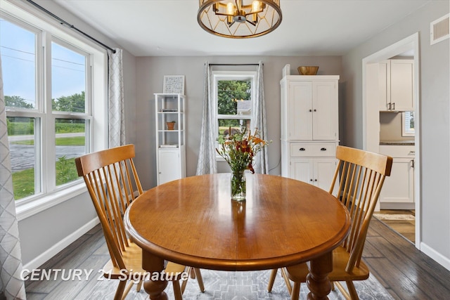 6357 Mackinaw Rd, Saginaw, MI 48604 - dining space with wood finished floors and a chandelier